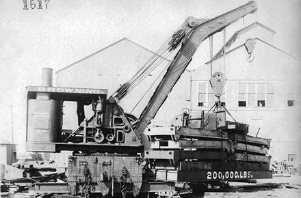 A wrecking crane lifts a test load.