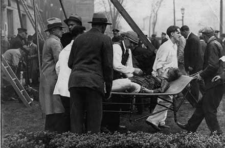 Assisting a victim of the Cleveland Clinic fire, 1929