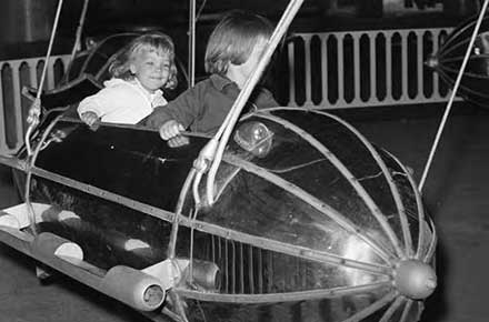Two young Green Thumb Club members on the kiddie rocket ride, 1964