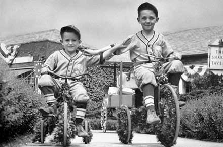 Francis and Donald Elliott on bikes at the Shaker Festival, 1936