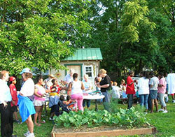 Kids in the garden, EcoVillage Community Garden, June 21, 2006